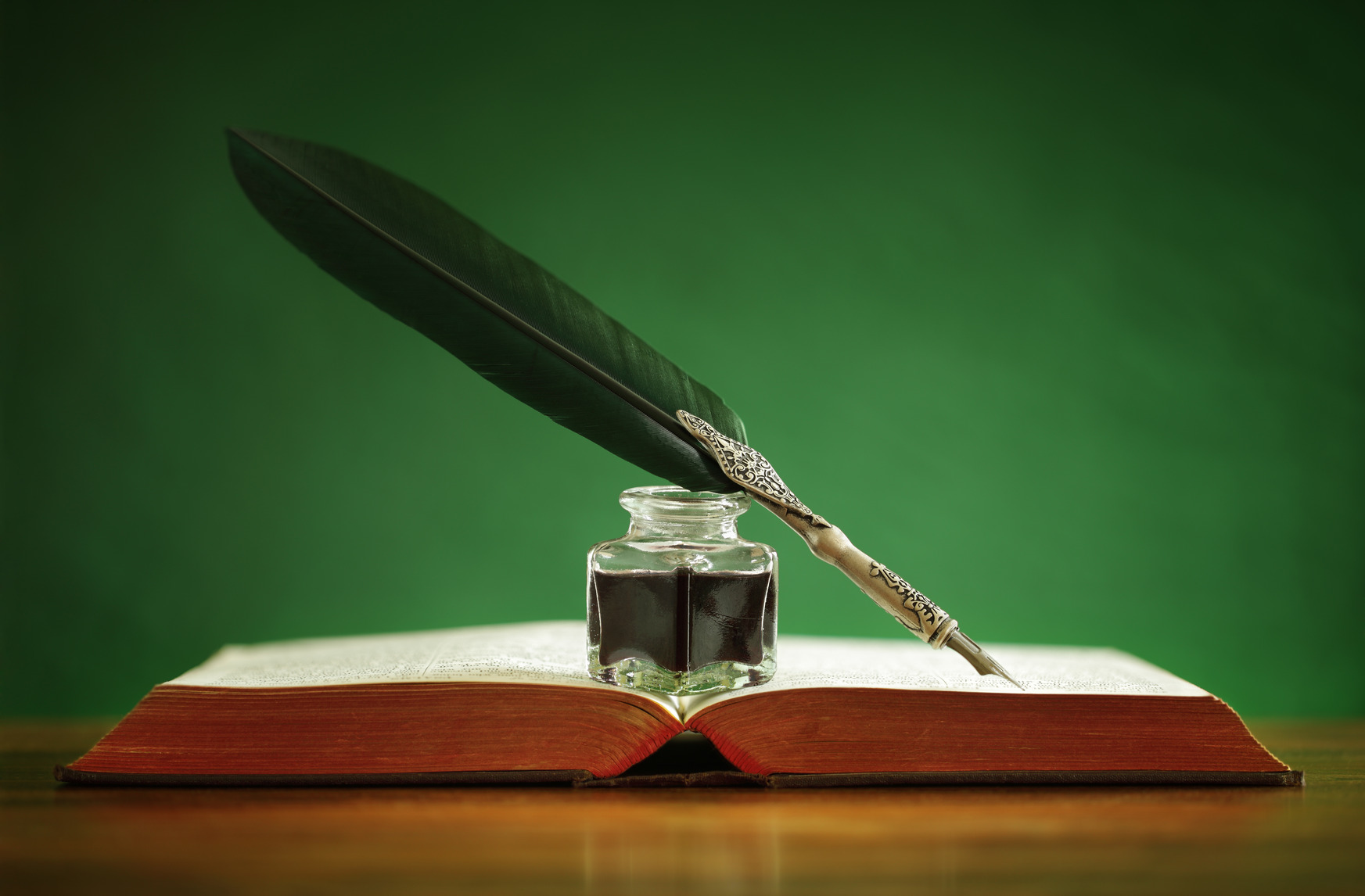 quill-pen-and-inkwell-on-old-book-m